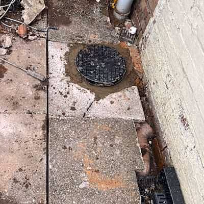 Completed manhole and drain cover installation
