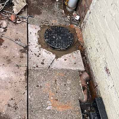 Completed manhole and drain cover installation