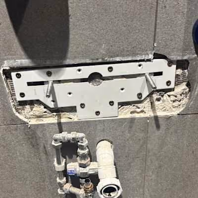 Wall-mounted concealed cistern valve installation