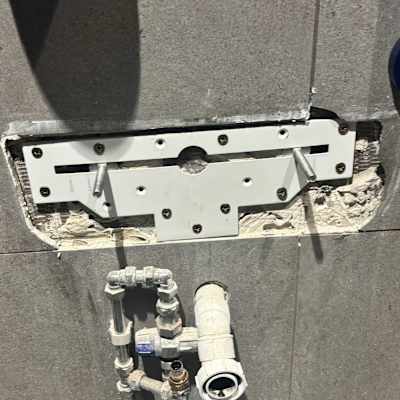 Wall-mounted concealed cistern valve installation